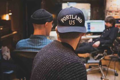 18 Happy stylish hipster man using technology